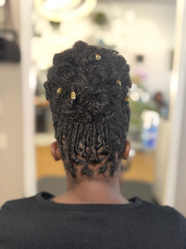 Loc updo with gold cuffs, back view