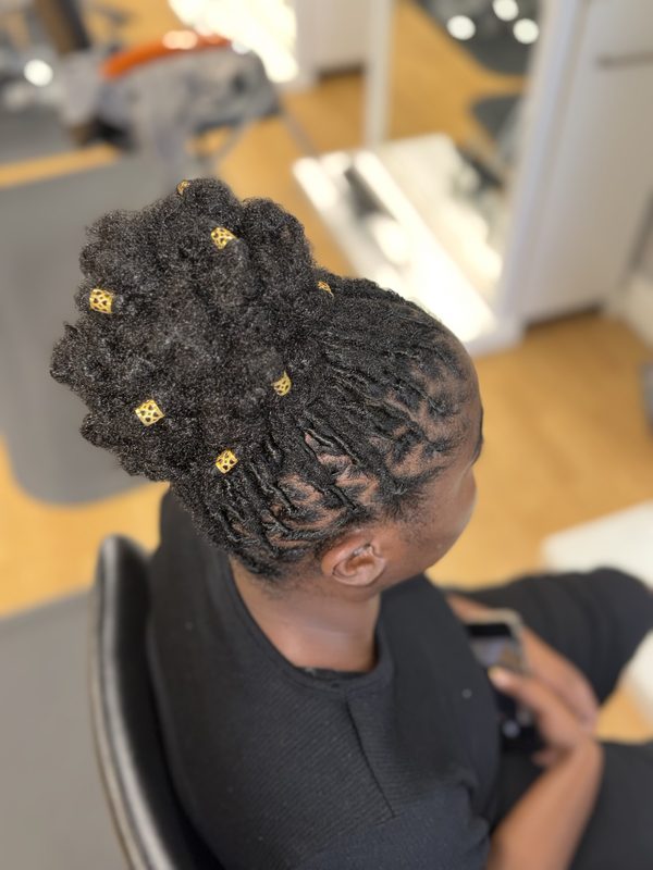 Loc updo with gold cuffs, top view